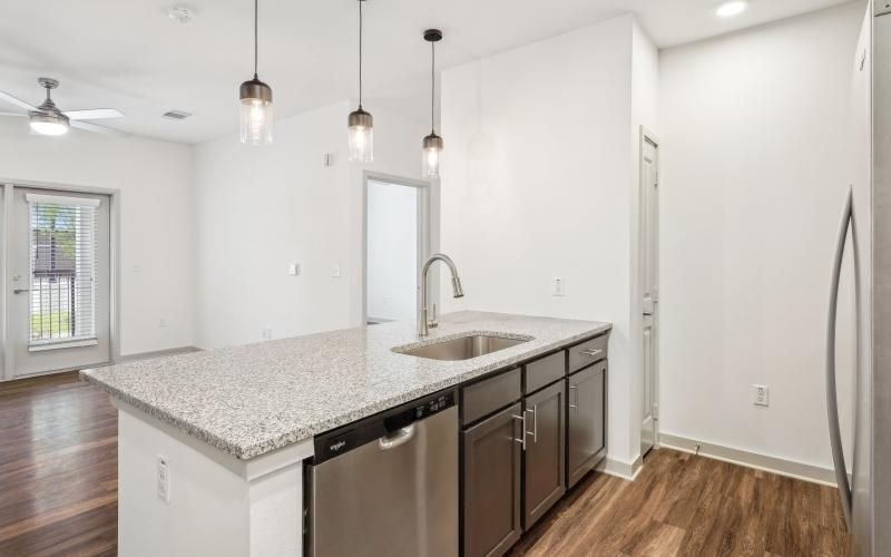 a kitchen with a marble countertop