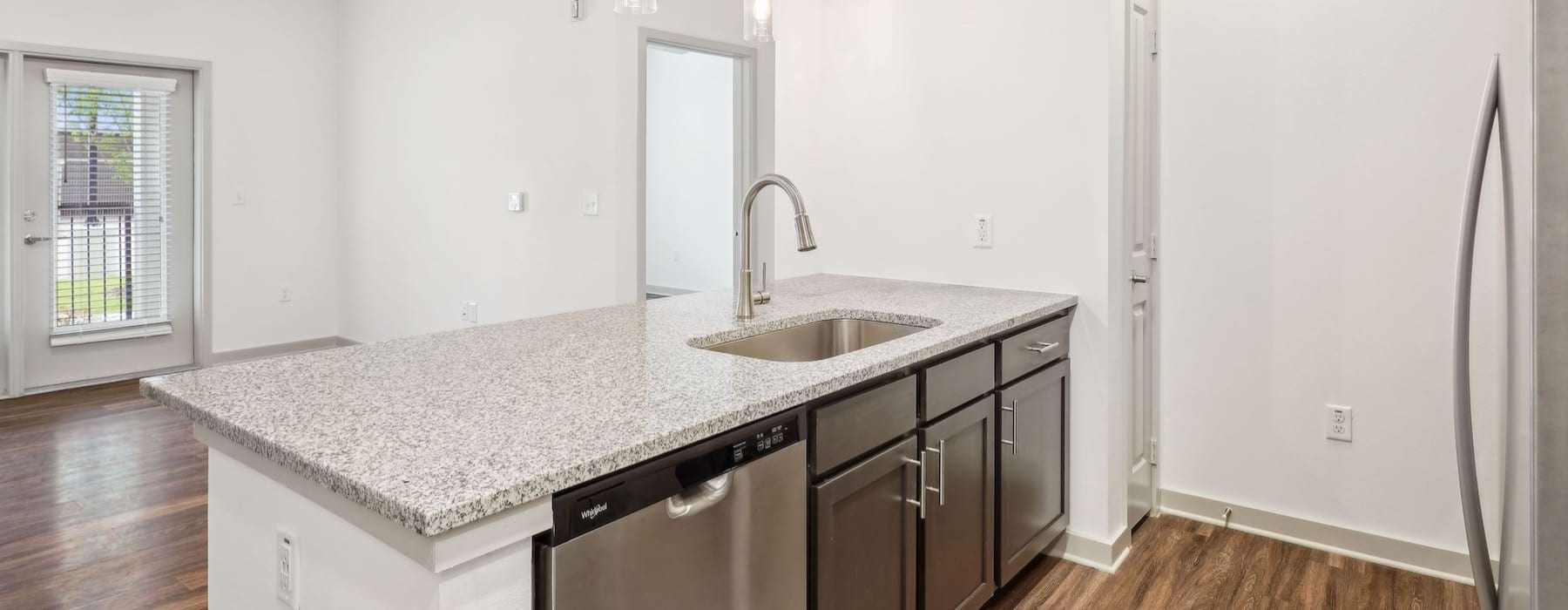 a kitchen with a marble countertop