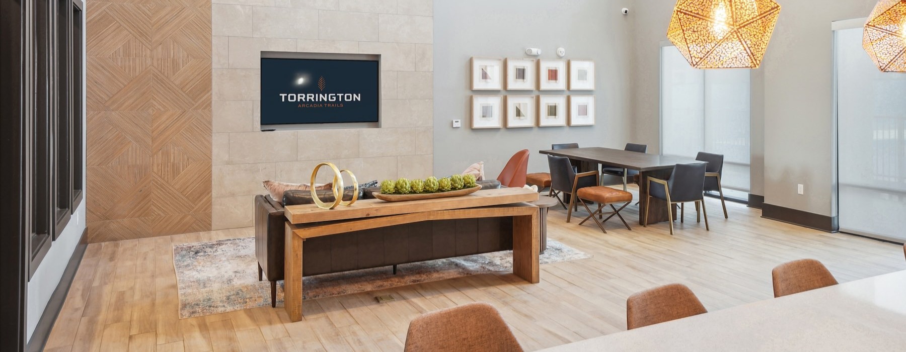 a clubroom with a tv, tables and chairs